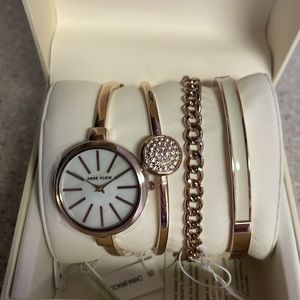 Brand new Anne Klein watch and bracelet set. Yellow-gold tone.